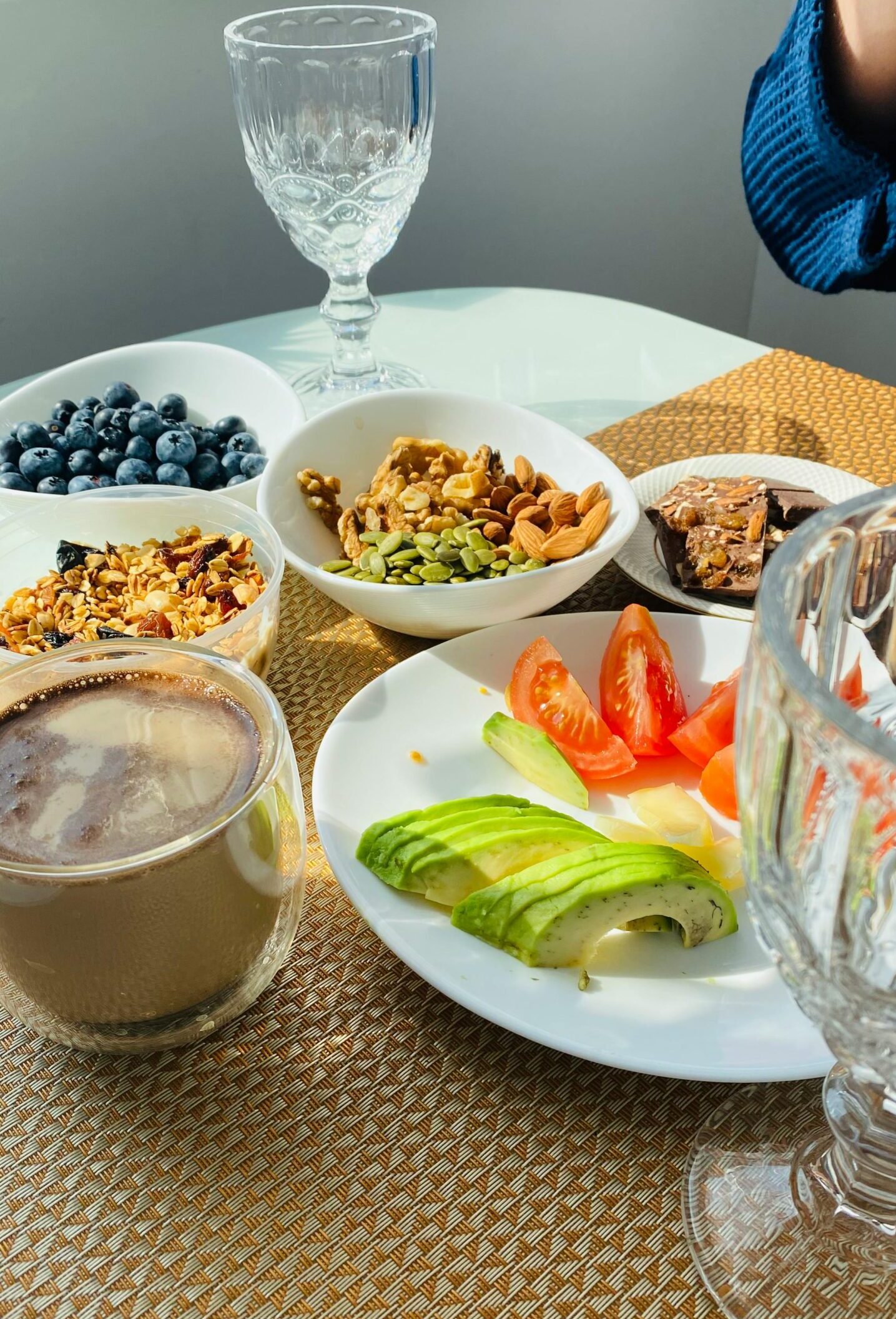 A delicious and nutritious breakfast with fruits, nuts, and coffee for a healthy start to the day.